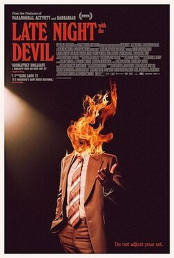 A photo of Jack Delroy (David Dastmalchian) with his head on fire.