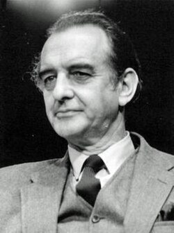Clean-shaven middle-aged man in suit and tie